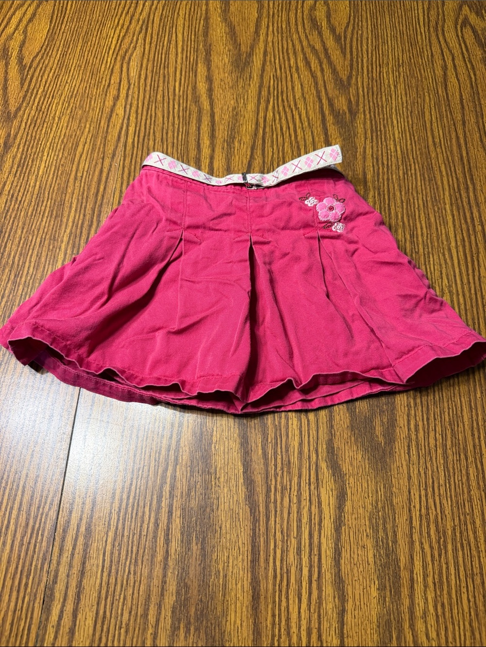 Girls Pink Pleated Skirt with Floral Accent